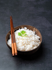 White rice in the bowl with dark background