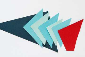 blue arrow-triangles being chased by a red shape on a white background