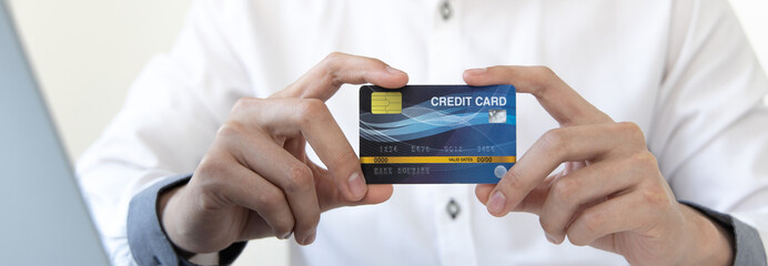 Online product purchase, Businessman use laptop register via credit cards to make online purchases, Shopping and mail, credit card online security, Online shopping concept.