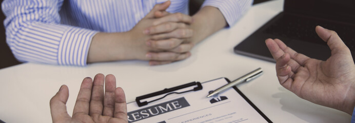 Employer or HR leader is interviewing participants, applying for a company employee, and having read the proficiency test resume to recruit qualified employees, Selection of job applicants.