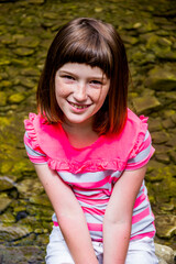 portrait of a litle girl near the river