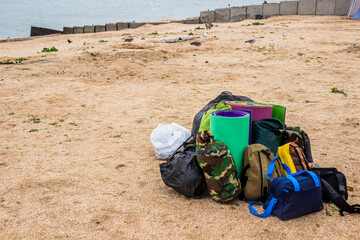 collected things are stacked in a pile on an empty sea beach, Sea of Azov, Ukraine