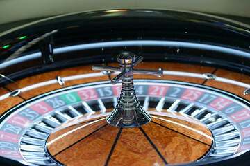 American roulette table, gambling. Roulette wheel spinning clockwise rotation, tourelle