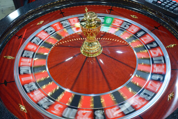 American roulette table, gambling. Roulette wheel spinning clockwise rotation, tourelle