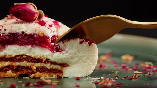 Mousse pink cake, creamy dessert close-up. Honey biscuits, raspberry-cowberry confit, almond streusel, yogurt white chocolate mousse made with honey and lime zest. 