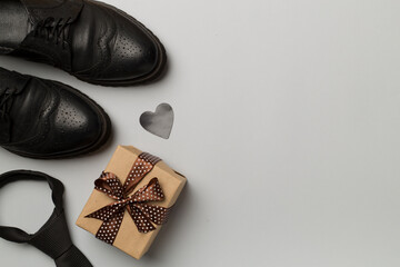 Father's Day accessories on color background, top view