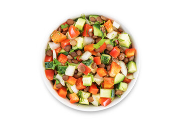 Lentil red bell pepper cucumber salad in a bowl on a white isolated background
