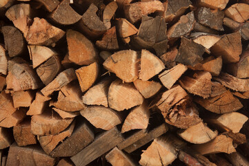 wall firewood, Background of dry chopped firewood logs in a pile