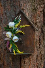 Beautiful Petunia flowers grow on a stump, garden decoration