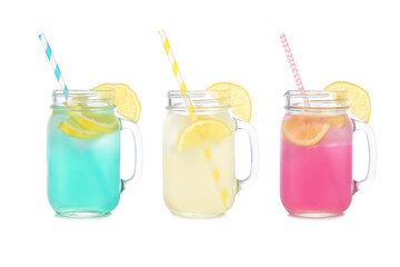 Cold, colorful summer lemonade drinks. Blue, yellow and pink colors in mason jar glasses isolated on a white background. - obrazy, fototapety, plakaty