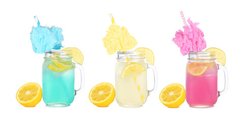 Cold, colorful cotton candy lemonade summer drinks. Three colors in mason jar glasses isolated on a white background.