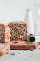 Fresh sliced bread on a wooden board.