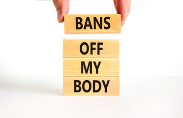 Bans off my body symbol. Concept words Bans off my body on wooden blocks on a beautiful white table white background. Women rights concept. Business social issues and bans off my body concept.