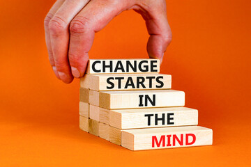 Change starts in the mind symbol. Concept words Change starts in the mind on wooden blocks on a beautiful orange table orange background. Business motivational and change starts in the mind concept.