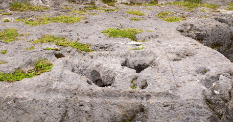 Square Inca carving on stone with holes - cusco Peru