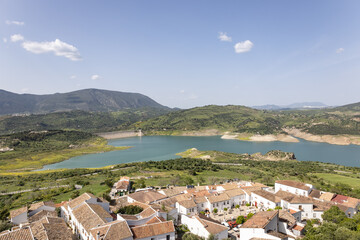 Panoramic view of Sierra de Grazalema (Grazalema Mountains) with Zahara-el Gastor Reservoir from the village of Zahara de la Sierra in Cadiz, Andalusia, Spain. - obrazy, fototapety, plakaty