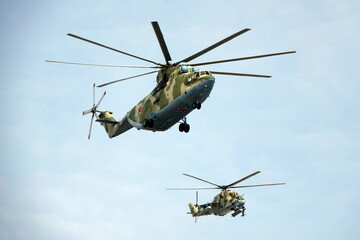 Fototapeta premium Military helicopters Mi-26 and Mi-24 over Moscow during the dress rehearsal of the parade dedicated to the 77th anniversary of Victory in the Great Patriotic War