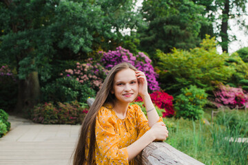 beautiful woman in summer in yellow dress