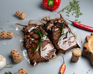 Pork steak in a vacuum packet with herbs