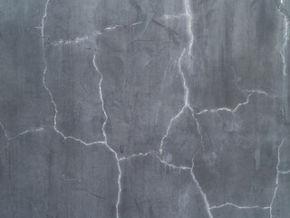 dark grey slate with cracks and dirty stains texture background