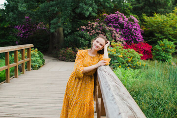 beautiful woman in summer in yellow dress