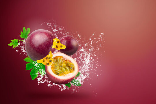 Water splashing on Fresh Passionfruit on red background.