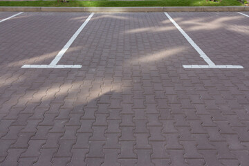 Parking lot on the street. Parking sign on the road. Parking space for auto. Empty slot for car. Urban transportation concept. Deserted street. Parking space. City traffic concept.