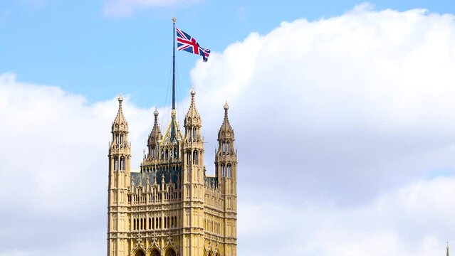 The footage of Parliament Tower and flying Union Jack in London on a summer day