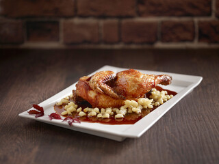 Crispy Roasted Chicken with Vinaigrette in Szechuan Style served in a dish side view on dark background