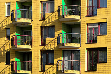 Colorful apartment building painted yellow and green, in Sarajevo, Bosnia and Herzegovina