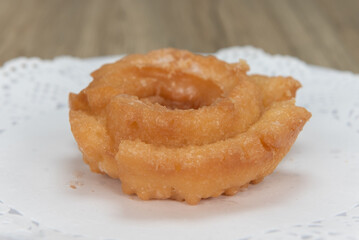 Tempting fresh from the oven old fashioned donut from the bakery served on a plate