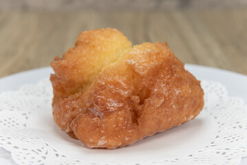 Tempting fresh from the oven buttermilk bar donut from the bakery served on a plate