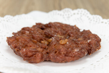 Tempting fresh from the oven apple fritter donut from the bakery served on a plate