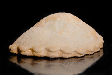 Close up: baked shortcrust pastry pie, flat cake with cottage cheese on tray in electric oven, black background. Homemade bakery, cooking and food concept