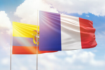 Sunny blue sky and flags of france and ecuador