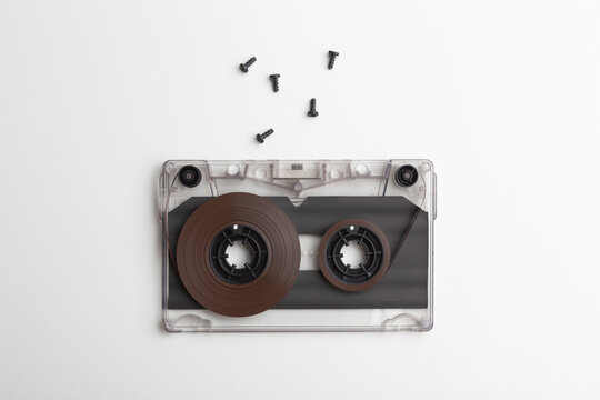 an unassembled compact audio cassette with screws