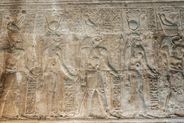 Bas-reliefs of the ancient Temple of Horus in Edfu, Egypt - obrazy, fototapety, plakaty
