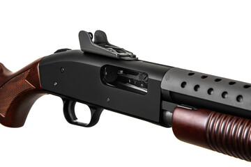 Modern pump-action shotgun with a wooden butt and fore-end isolate on a white back. Weapons for sports and self-defense. Armament of police, army and special units.