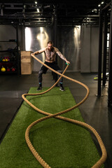 Rope warehouse fitness green man grass training gym muscular young, for strong strength from physical from healthy activity, person muscle. Cross ground holding,