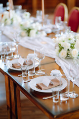 Banquet table with wedding and festive serving. Wedding, birthday, party, event concept.