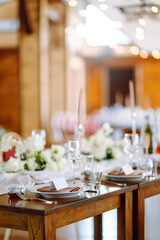 Banquet table with wedding and festive serving. Wedding, birthday, party, event concept.