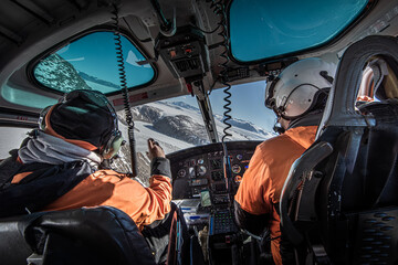 Scientists in helicopter over dry valleys, Antarctica