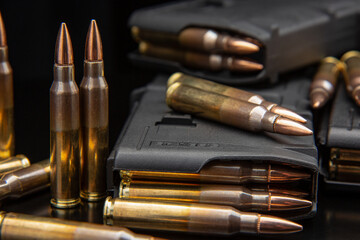 Bullet isolated on black background with reflexion. Rifle bullets close-up on black back. Cartridges for rifle and carbine on a black.