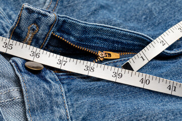 Pants and waist measurement tape. Diet, weight loss and gain concept.