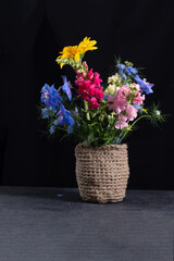 Fototapeta na wymiar bouquet in jute pots 