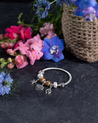 bracelet on a background of flowers

