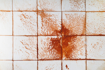 abstract wet rust scattering on a tile background