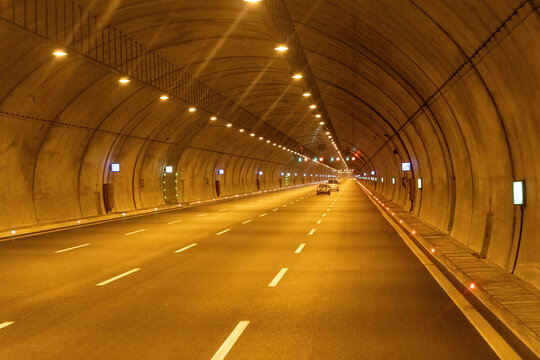 Fototapeta Highway vehicle tunnel inside. Multi-lane road tunnel