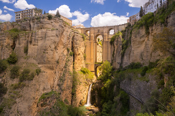 Scenic landscape view of an old stone bridge over the canyon in Ronda, Spain at Puente Nuevo Bridge, Arch, Andalusia, Spain   © vladimir