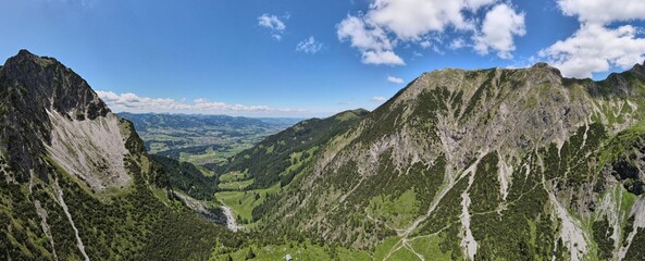 Mountain range with green parts of bushes. Oberstdorf, Alps.